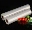 Clear Plastic Roll Bag for checkout super market with groceries in a black background