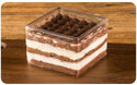 Square Clear Cake Container W/ Lid | 9.5x9.5x6.5cm - 200 Sets for bakery store on a wooden desk with chocolate flavor 